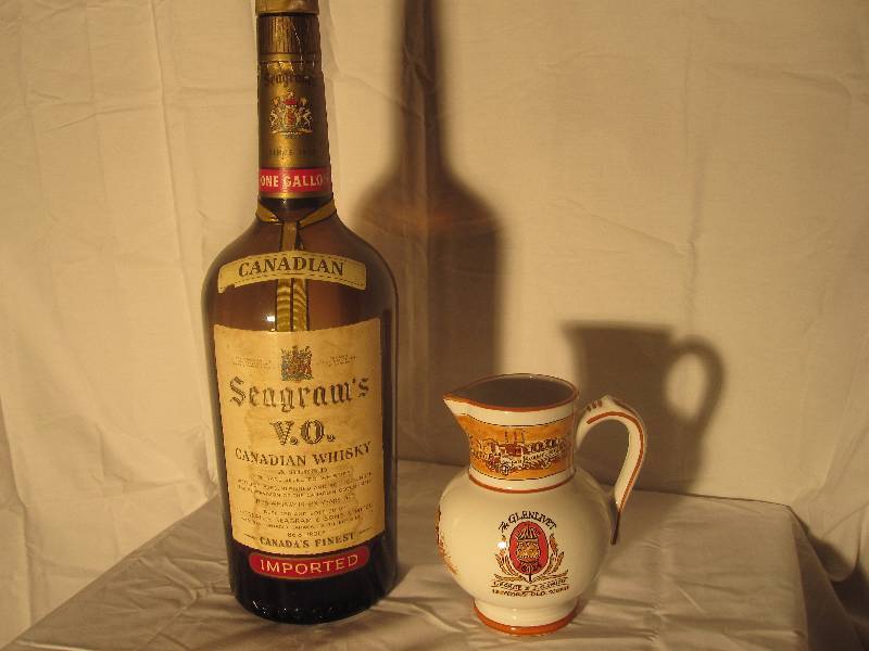 lot 15 image: Large Seagrams Canadian Whiskey bottle & Glenlivet Scotch pitcher