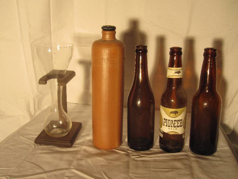 lot 18 image: Lot of 3 Vintage beer bottles, half yard vintage glass & earthenware bottle