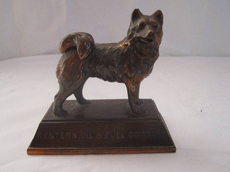 lot 71 image: Rare vintage Western Oil and Fuel brass paperweight