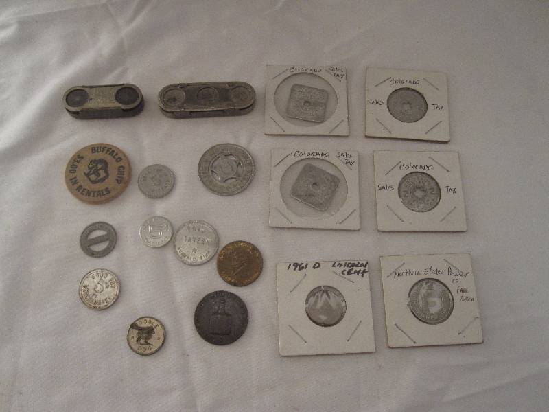 lot 96 image: Vintage lot of tokens, coins and bus fare dispensers
