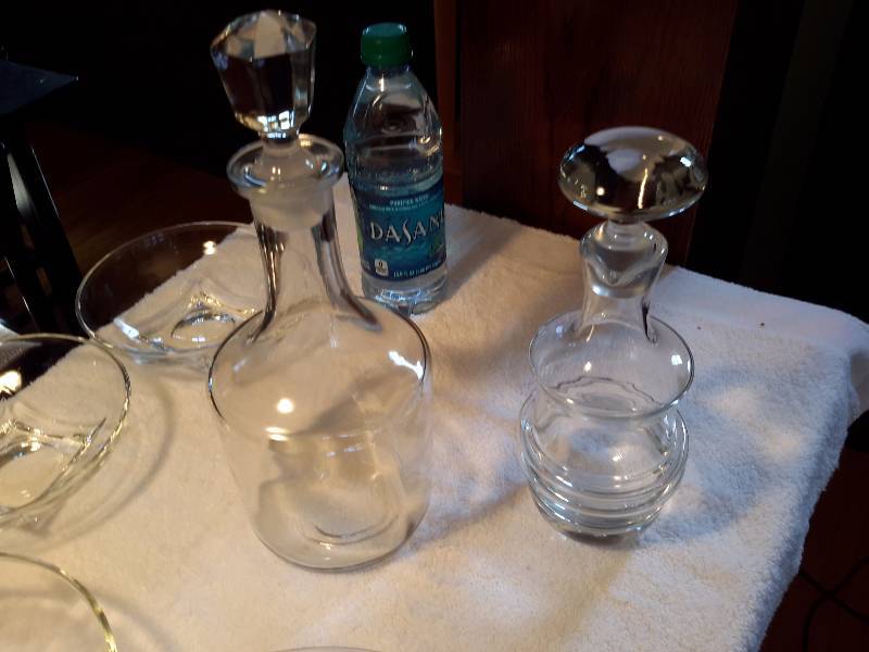 2 decanters and Misc. Bowlsplates as pictured