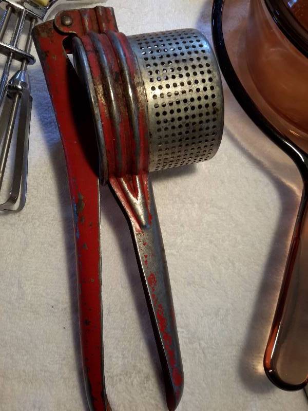 Misc. Kitchen Utensils.. A Couple of Vintage.. Hand Mixer and ricer