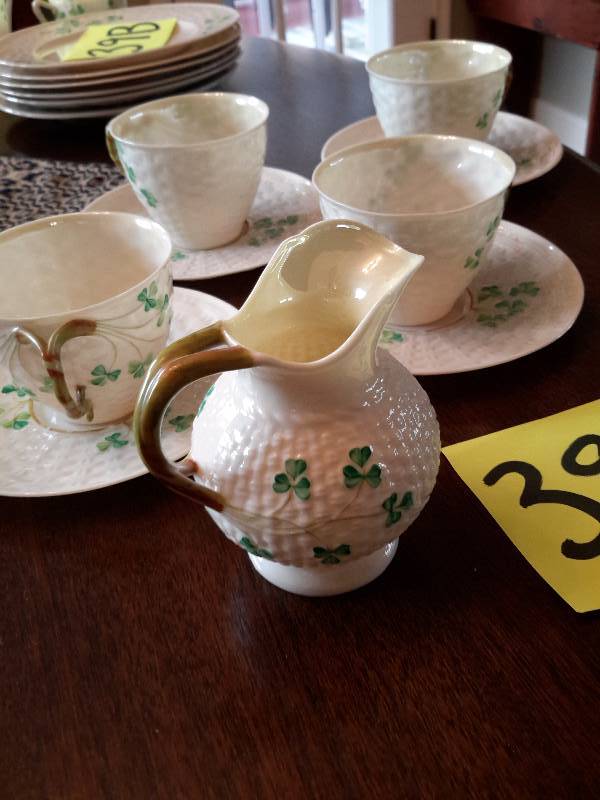 5 Beleek coffee cups and saucers, small milk pitcher