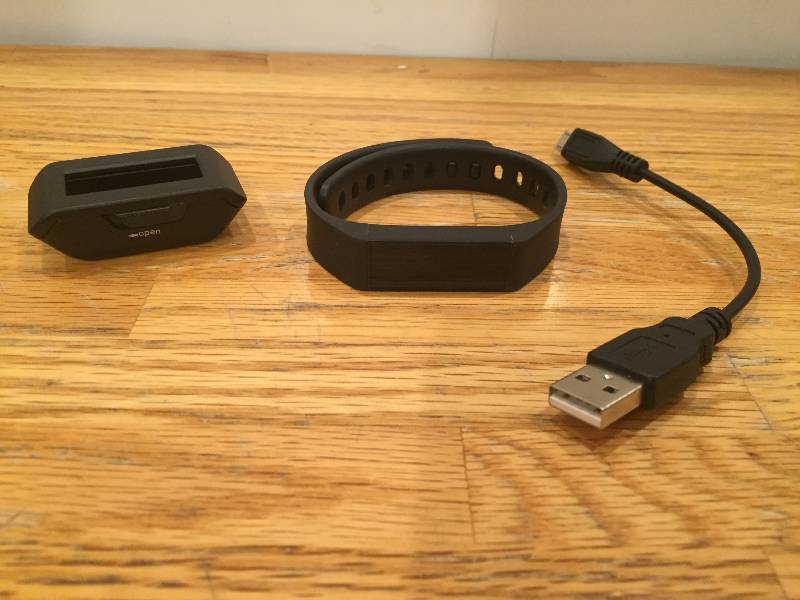 lot 45 image: Fitness Band with charger