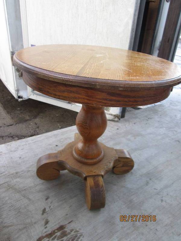 lot 37 image: small round wood table, 22 across,...