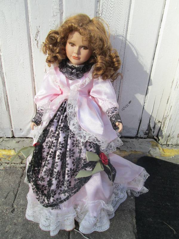 lot 152 image: Old fashioned doll with pink dress ...