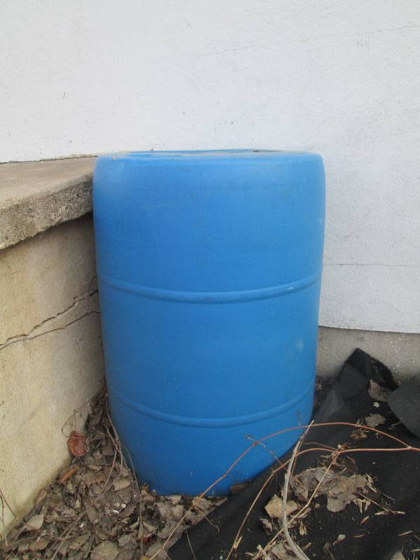 lot 179 image: Blue 55 gallon barrel...