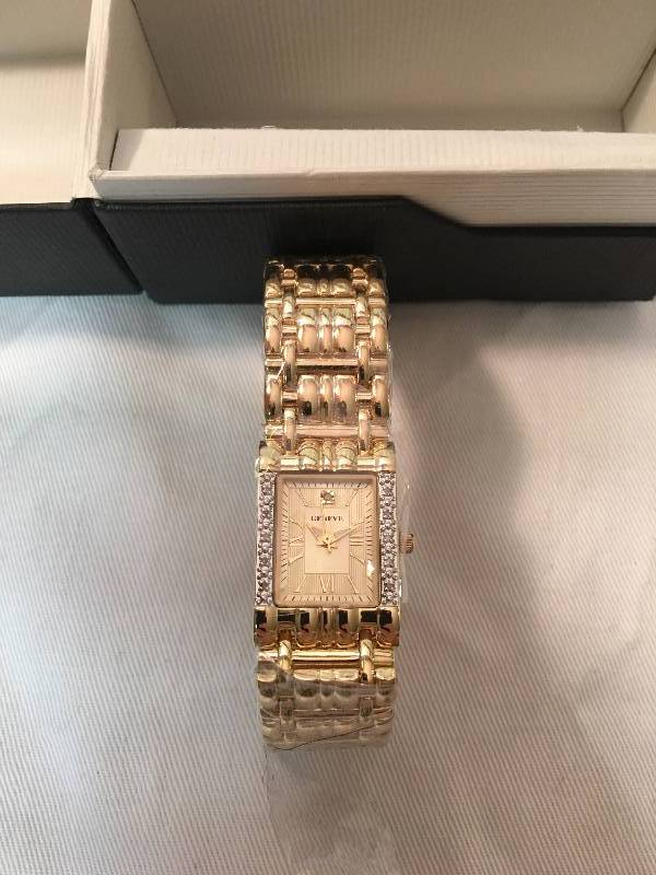 lot 3 image: Geneve Ladies Gold Tone Diamond Watch