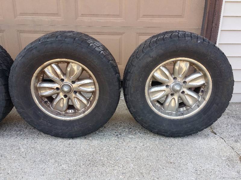 Nitro Terra Grappler All-Terrain LT325  60R  18 Tires on American Racing Wheels
