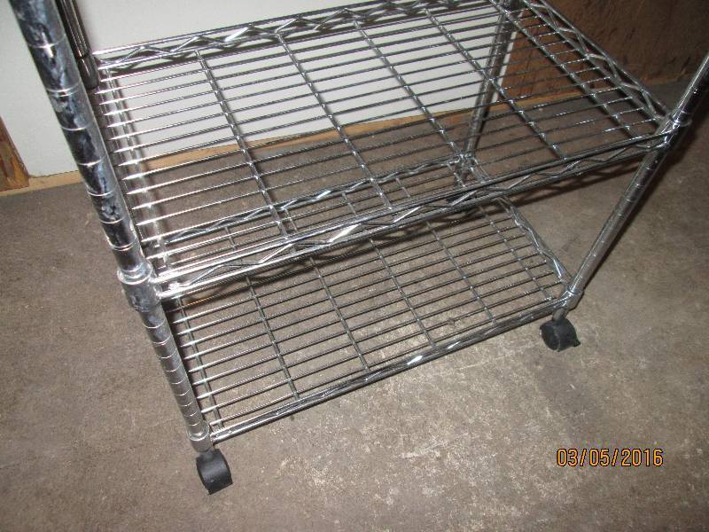 lot 26 image: Metal storage shelf on wheels, 13 x...