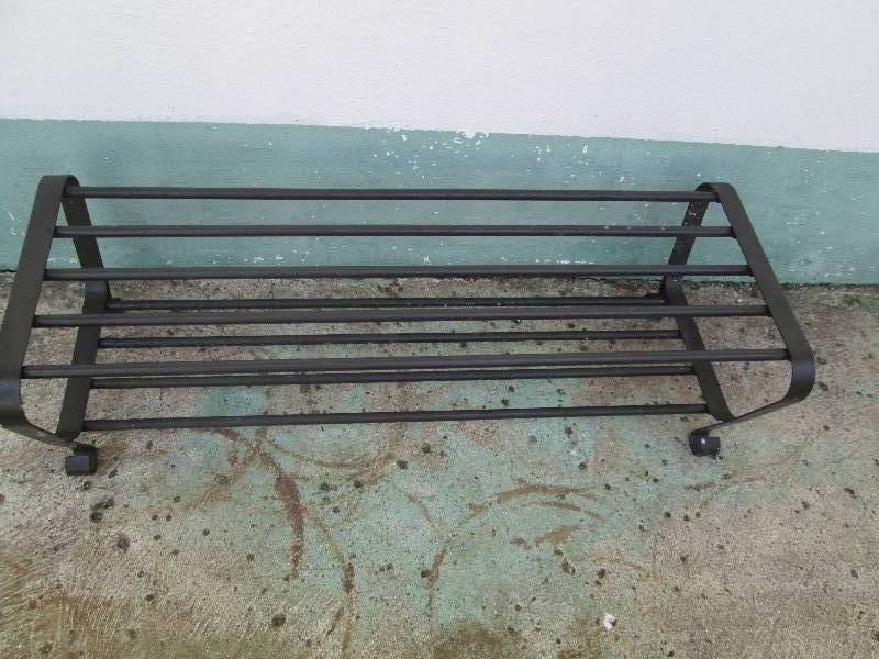 lot 23 image: Metal shoe rack 3 feet wide...