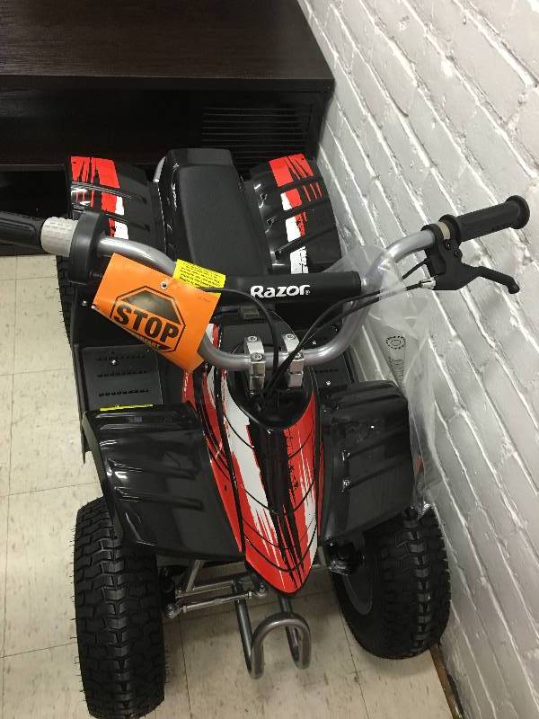 lot 255 image: Razor Dirt Quad Electric Off-Road Vehicle retail $399