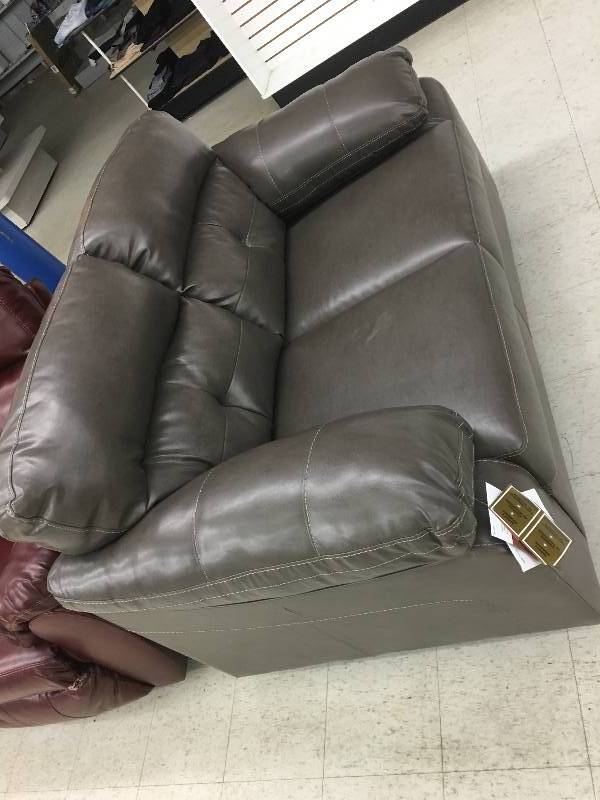 lot 297 image: Ashley Loveseat Gray retail $599 with tags