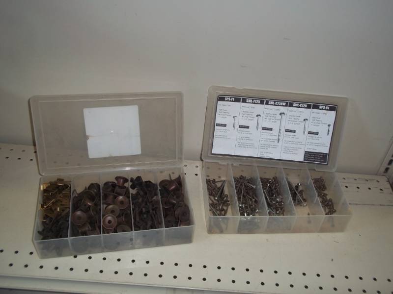 lot 4 image: 2 bins- assorted screws and knobs and hinges