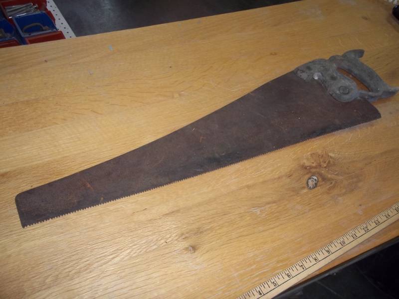 lot 14 image: vintage wood saw 25 12 blade, wood handle is hand carved