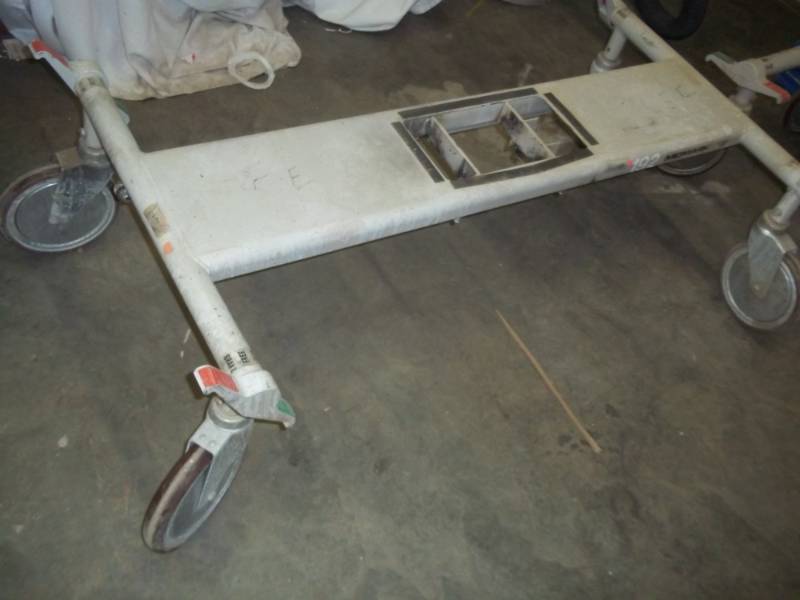 lot 126 image: Gurney table base, great for shop cart, midmark roller