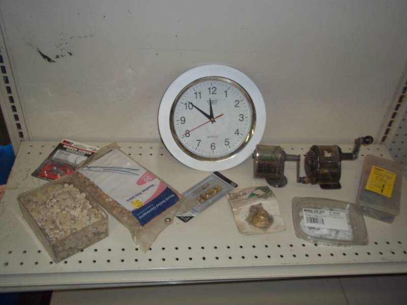 lot 131 image: assorted lot wood plugs, clock, pencil sharpeners