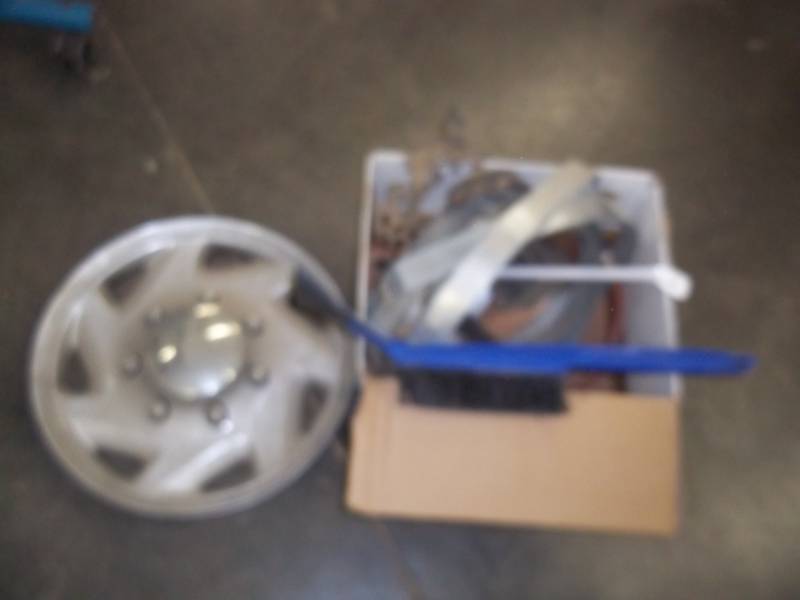 lot 143 image: assorted lot (hose and splitter, hub cap, cabinet door dcor)
