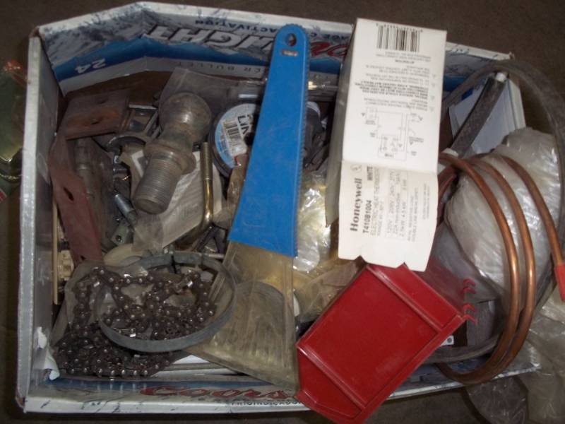lot 226 image: Box with hitch ball, chain saw chain, copper tubing, hinges