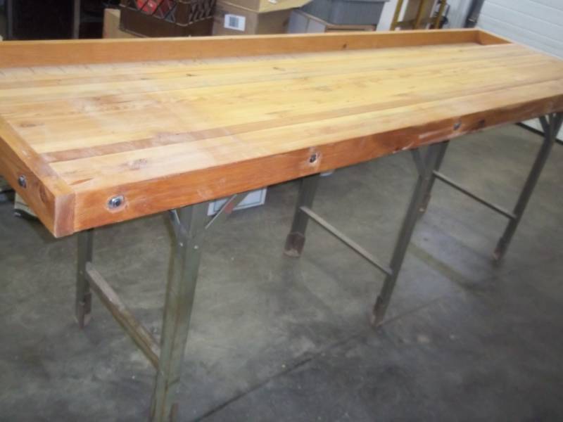 lot 301 image: Wood Working Bench with wood top and metal base,  Wood top is 29 X 97  Metal Table 24 wide x 92 Long x 33 High