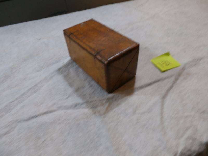 Sewing machine attachments in wood box