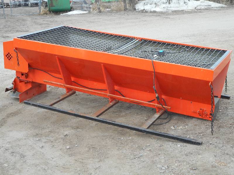 lot 1 image: CommercialIndustrial 10ft Steel SaltSand Spreader, Briggs & Stratton IC 10.5HP Gas Engine, In-Cab Controls, Mounted To A Steel Frame, In Good Condition.  Loading Will Be Provided.
