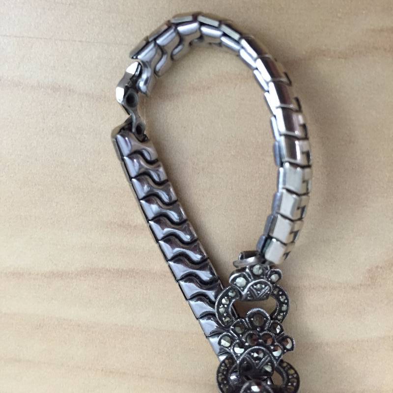 lot 43 image: Antique Womens Ladies Jeweled Watch - What we know - Swiss Made (parts inside) - Case (house parts) is made of Sterling - Crystals are not Diamonds - It is currently Not Working