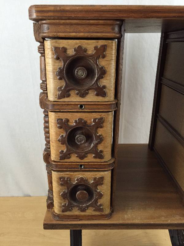 lot 66 image: Big WOW Simply Amazing & Stunning Antique Repurposed Singer Treadle Sewing Table Cabinet w Highly Decorated Drawers & Cast Iron Base on Rolling Casters 19x18x32