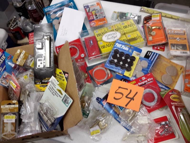 Large lot of picture hanging and door lockstop hardware