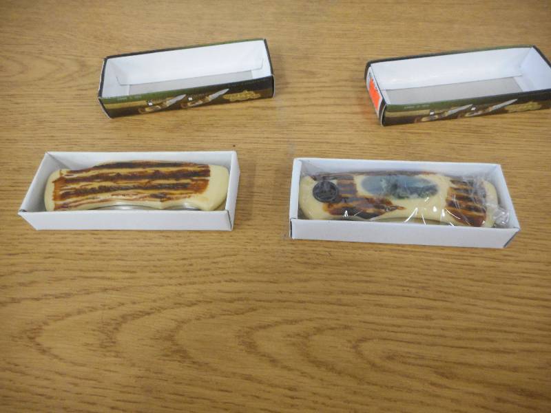 lot 42 image: (2) WOOD GRAIN POCKET KNIFES