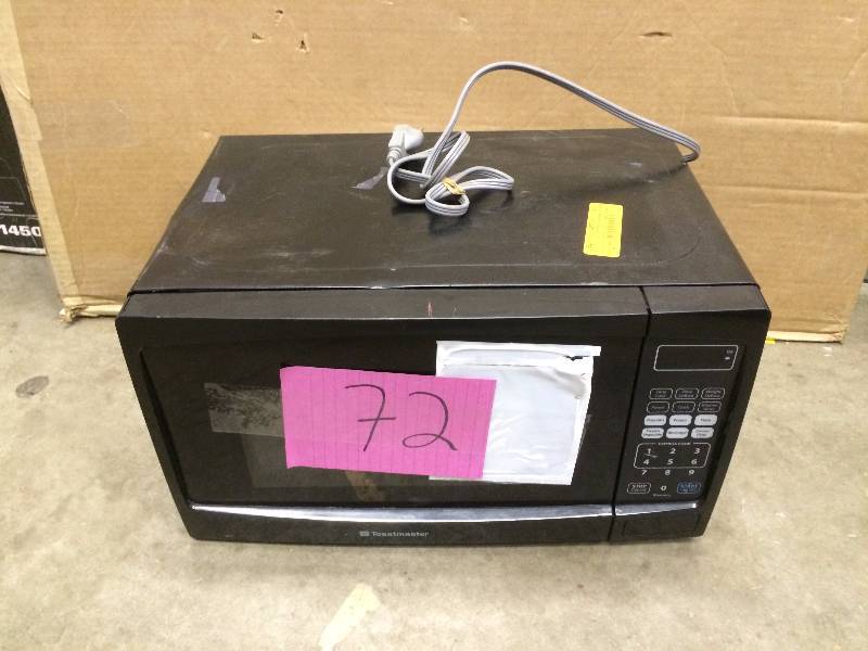 lot 72 image: Toastmaster Microwave - small Dent on top tested works