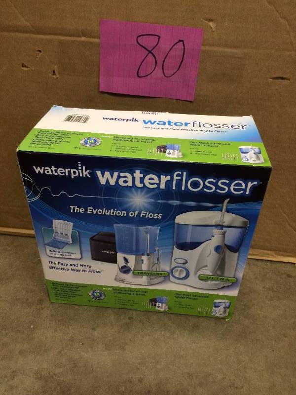 lot 80 image: WaterPik Water Flosser