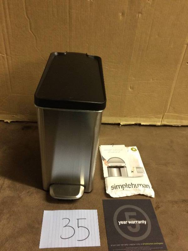 lot 35 image: simplehuman  10 Liter Profile Step Trash Can in Brushed Stainless Steel with Black Plastic Lid NEW small damage on the back