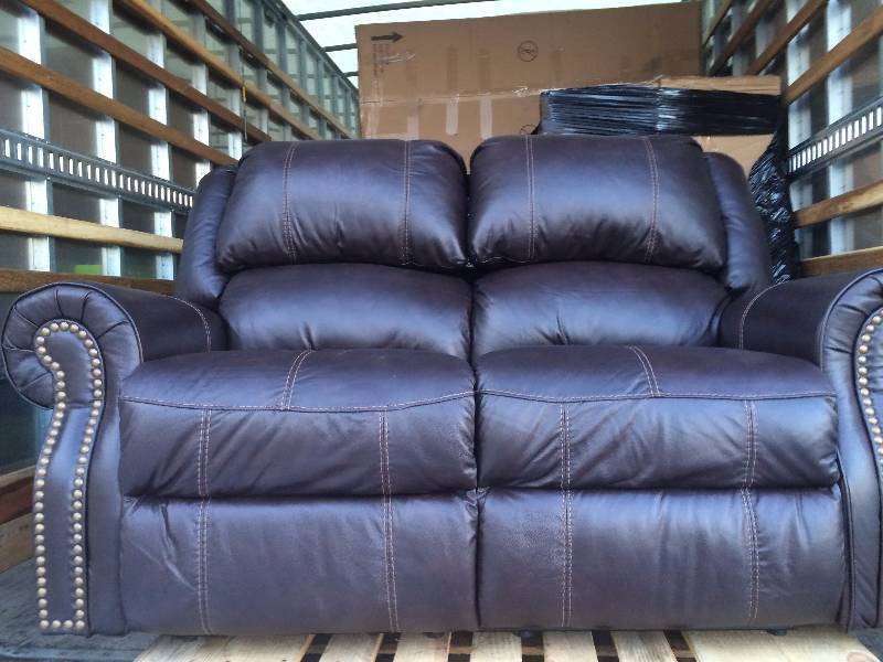 lot 62 image: Berkline Reclining Leather Loveseat New