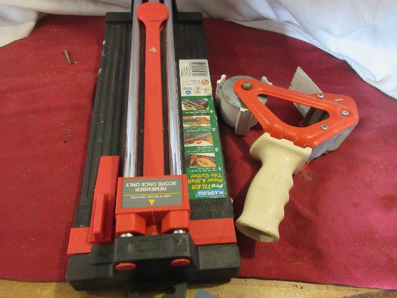 lot 103 image: TILE CUTTER AND UNILINE TAPE DESPENSER