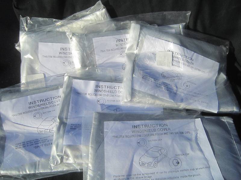 7 NEW IN PACKAGES WINDSHIELD SUN COVERS