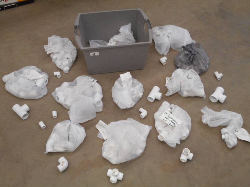 lot 61 image: Tote Full Of Assorted PVC Pipe Fitt...