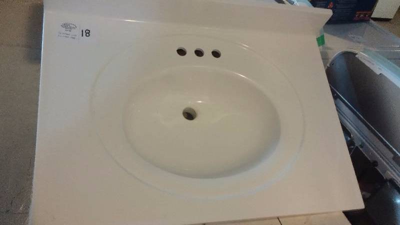 lot 18 image: Cultured marble vanity top - 31 inches