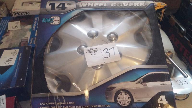 lot 37 image: 14 inch wheel covers and steering wheel
