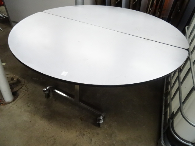 lot 34 image: Fold Up Round Table on Wheels 60