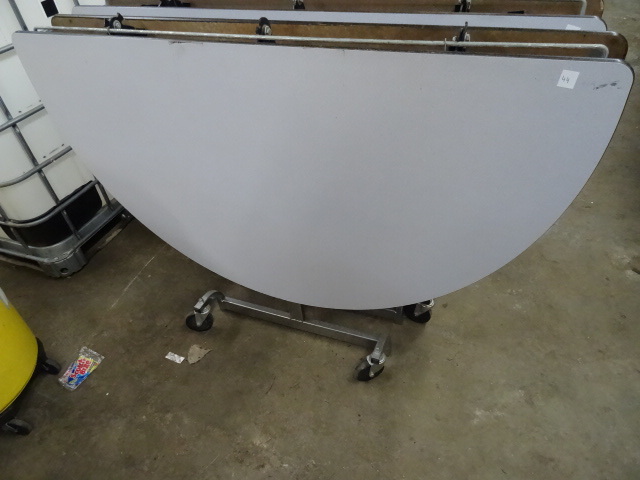 lot 46 image: Fold Up Round Table on Wheels 60