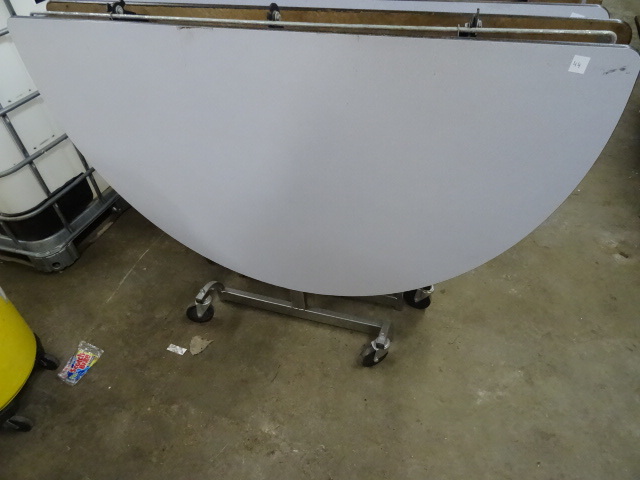 lot 48 image: Fold Up Round Table on Wheels 60