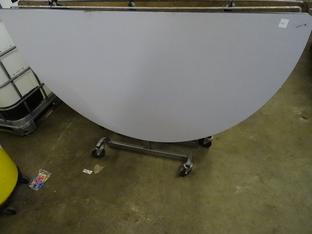 lot 49 image: Fold Up Round Table on Wheels 60
