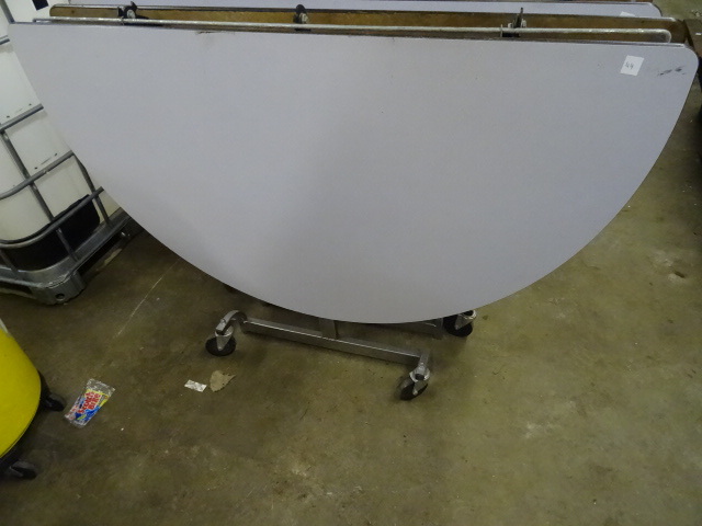 lot 50 image: Fold Up Round Table on Wheels 60