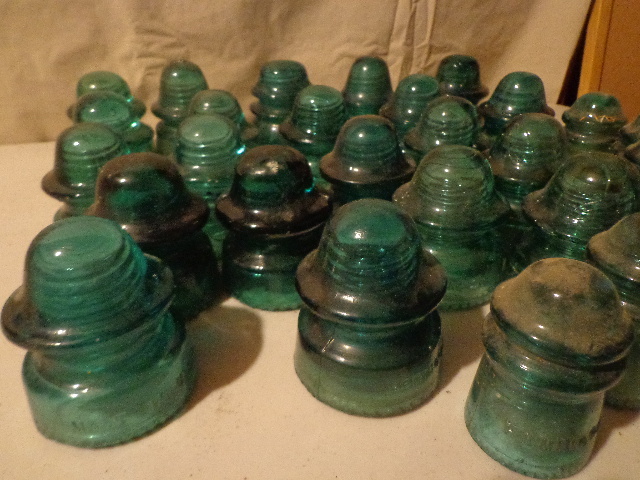 lot 89 image: Green Glass Insulators