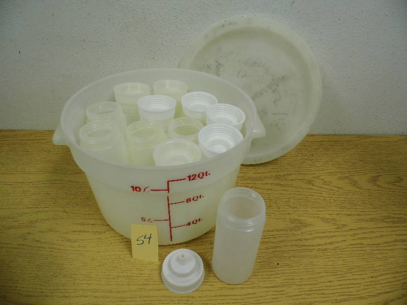 lot 54 image: 12 Quart Container w Condiment Bottles