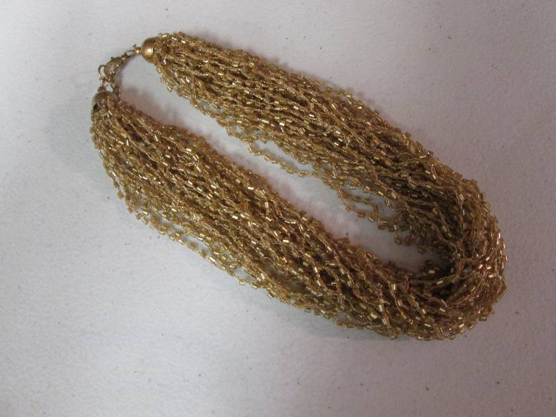 lot 110 image: Gold beaded necklace...