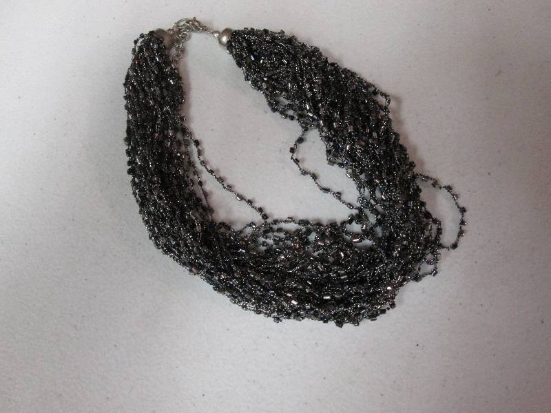 lot 111 image: Black beaded necklace...