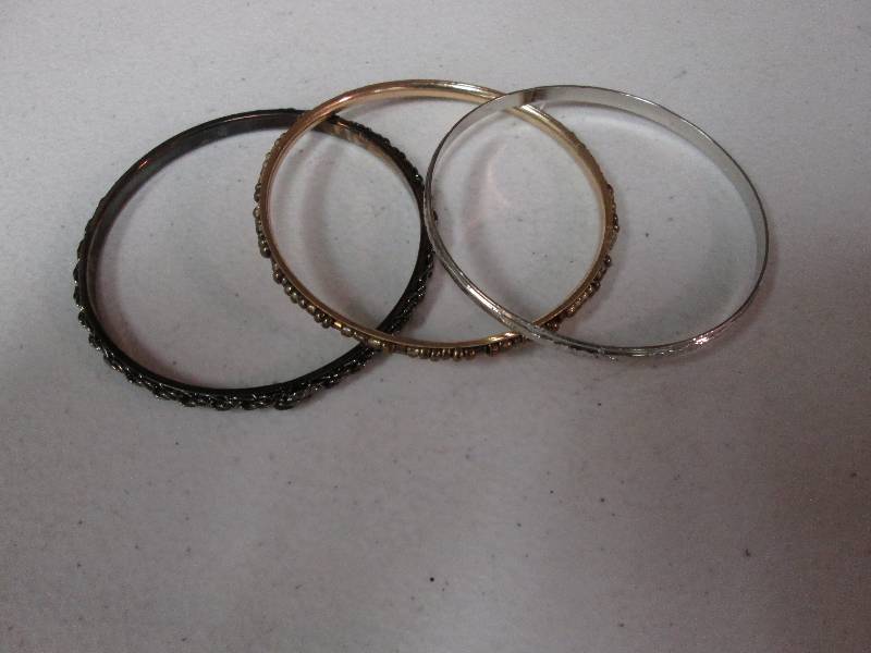 lot 113 image: Set of 3 bangle bracelets black go...