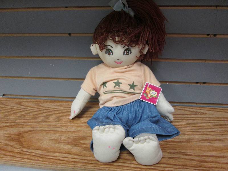lot 127 image: Cloth doll with brown hair...